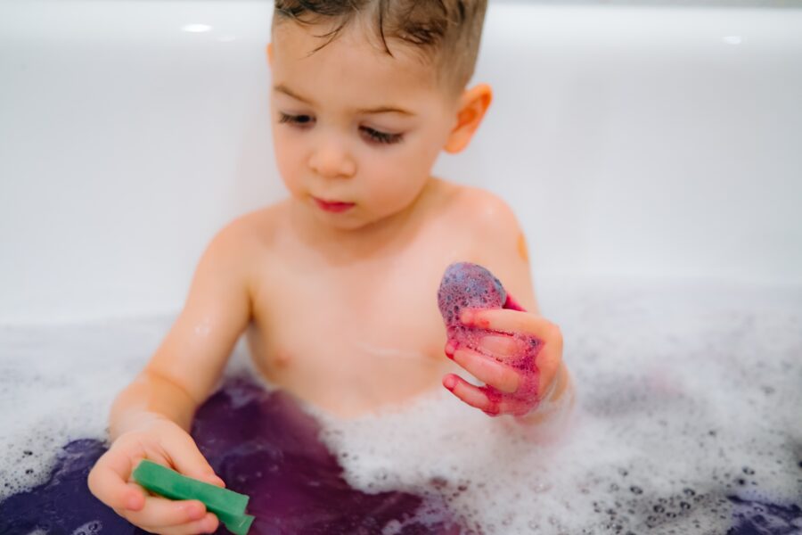 Child in bath with bubbles